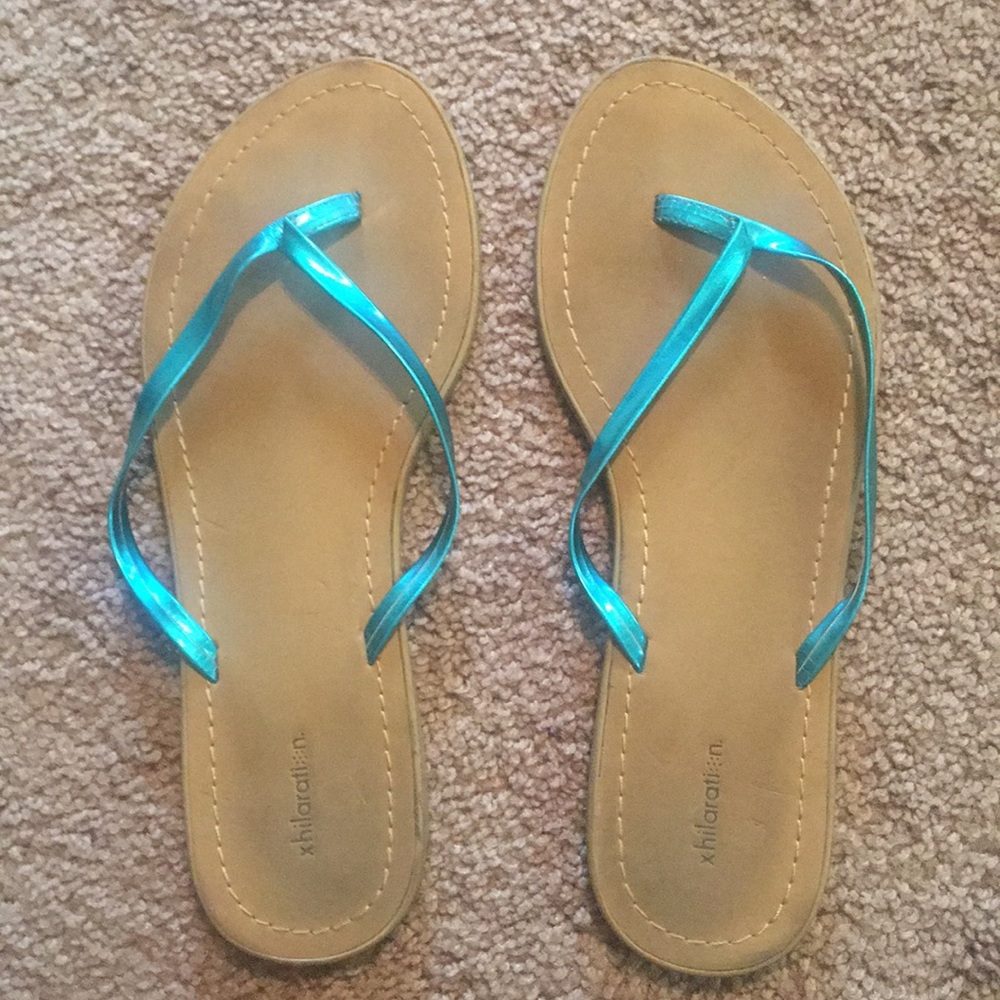 Shiny teal flip flops